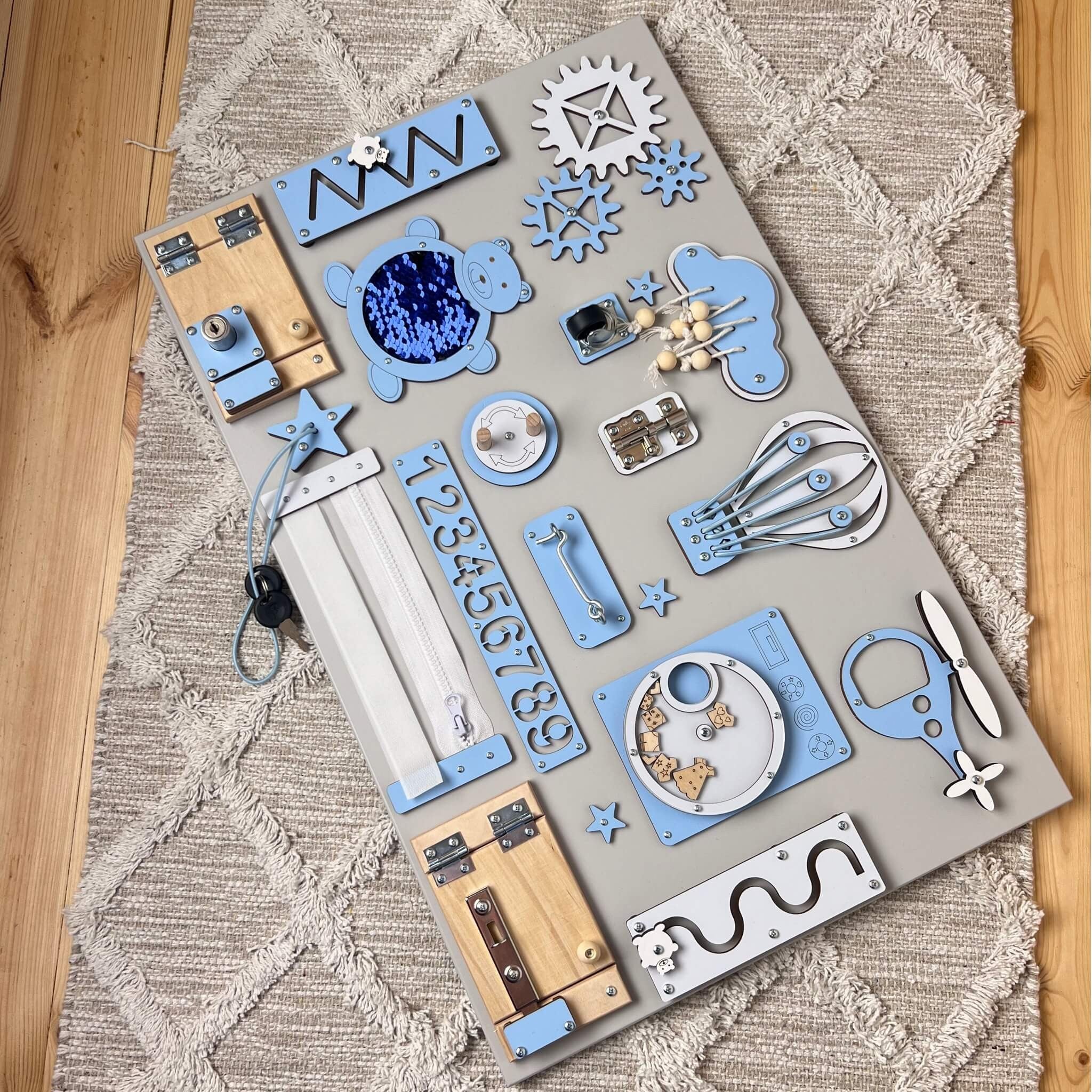 Montessori busy board with doors and locks (40×60 cm)